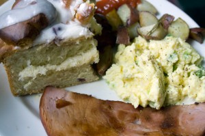 Scrambled eggs with asparagus & spring onions, green salad with radishes, cukes, and torn bread garlic croutons, fried Nueskes ham, rosemary-roasted potatoes, blueberry cinnamon rolls, baby biscuits