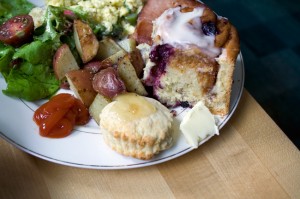 Scrambled eggs with asparagus & spring onions, green salad with radishes, cukes, and torn bread garlic croutons, fried Nueskes ham, rosemary-roasted potatoes, blueberry cinnamon rolls, baby biscuits