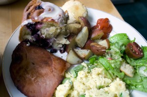 Scrambled eggs with asparagus & spring onions, green salad with radishes, cukes, and torn bread garlic croutons, fried Nueskes ham, rosemary-roasted potatoes, blueberry cinnamon rolls, baby biscuits