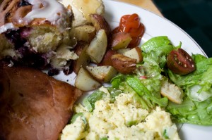 Scrambled eggs with asparagus & spring onions, green salad with radishes, cukes, and torn bread garlic croutons, fried Nueskes ham, rosemary-roasted potatoes, blueberry cinnamon rolls, baby biscuits