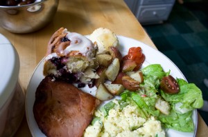Scrambled eggs with asparagus & spring onions, green salad with radishes, cukes, and torn bread garlic croutons, fried Nueskes ham, rosemary-roasted potatoes, blueberry cinnamon rolls, baby biscuits