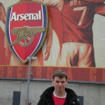 Ethan by the Arsenal players' bums painted on the stadium