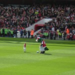 One of the kids that walked in with the players, with the mascot