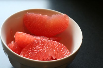 Pink grapefruit in a chipped white bowl