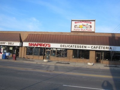 From across the street, so you can see how big it is - my shadow in lower right. Meredith offered to take a picture with me in front of the sign, a Shapiro, at Shapiro's - too meta for me
