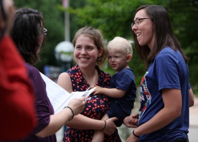 Rose Grindrod, left, marries Meghan Hamilton, both of Madison, with their son, Harry Hamilton, 2, outside the City-County Building in Madison on Saturday. The couple has been together for eight years and deserves the same right to pursue happiness as others. 