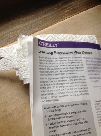 Learning Responsive Web design, interleaved for drying. I guess I learned some stuff in my preservation courses in library school. It's only paper towel, and will leave a crinkle pattern on the pages, but at least I'll be able to read them.