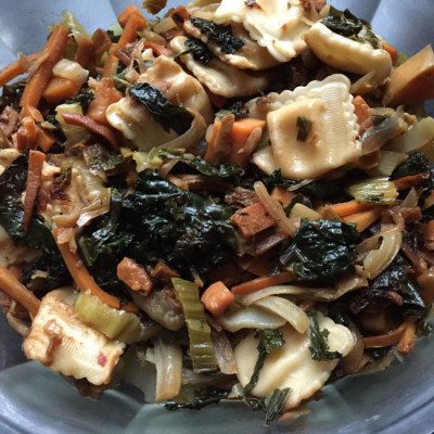 Cultural mashup bottom of the vegetable bin stirfry with onions, sweet potato, carrots, ginger, soy sauce & sesame oil and garlic, and kale and bok choy - and baby Parmesan cheese ravioli