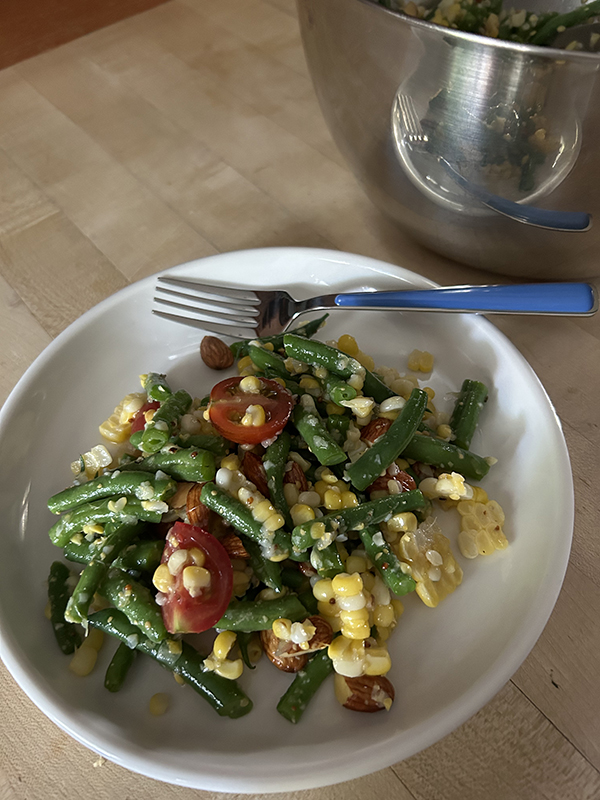 corn and green bean salad with cherry tomatoes and nuts